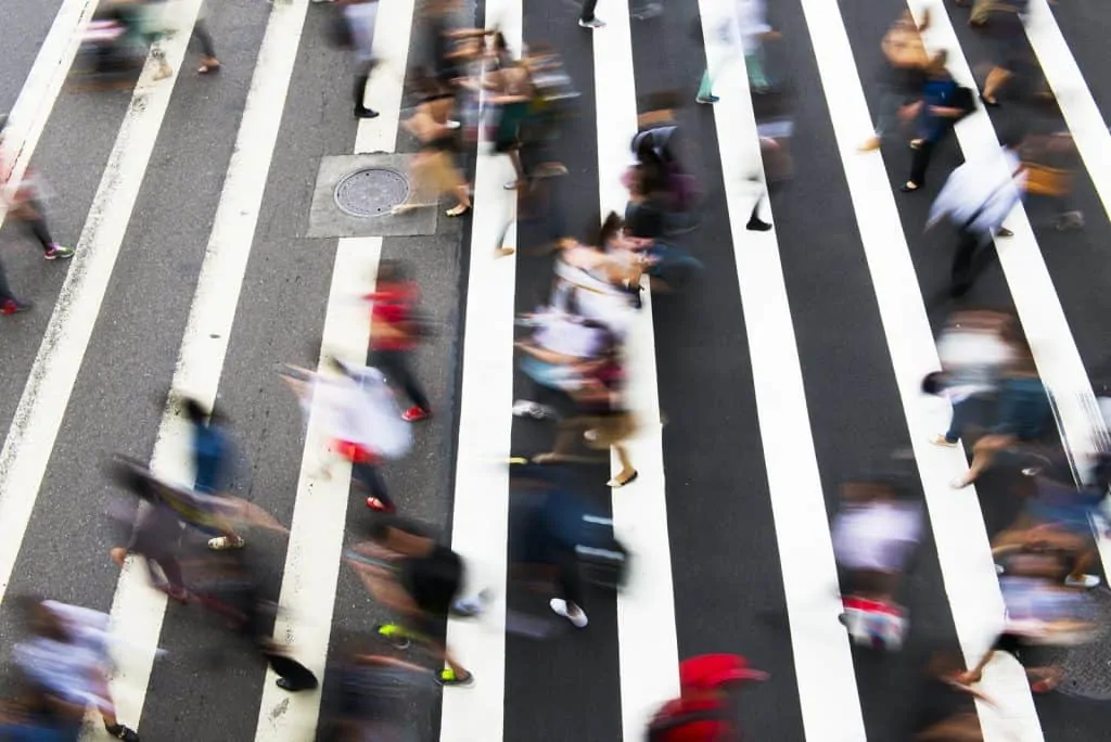 People walking across a crosswalk