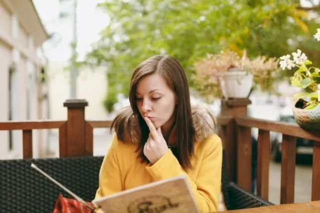 woman thinking of what to order