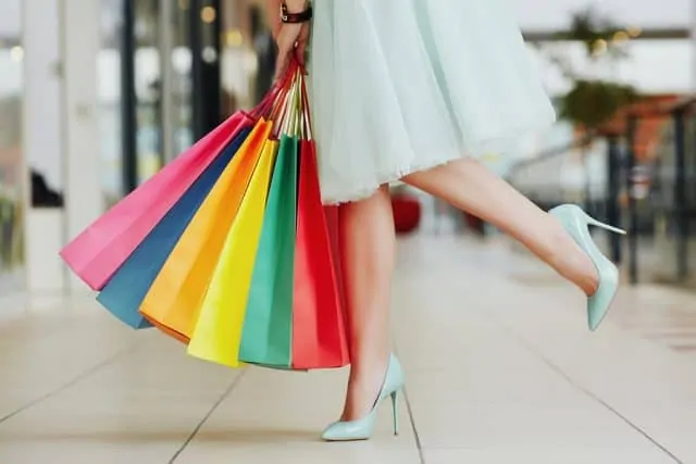 Girl In Shopping Mall With Bags