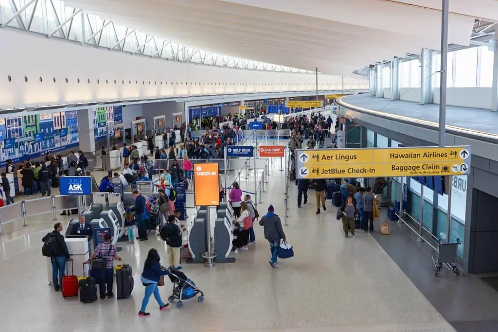 People at the check-in area of an airport