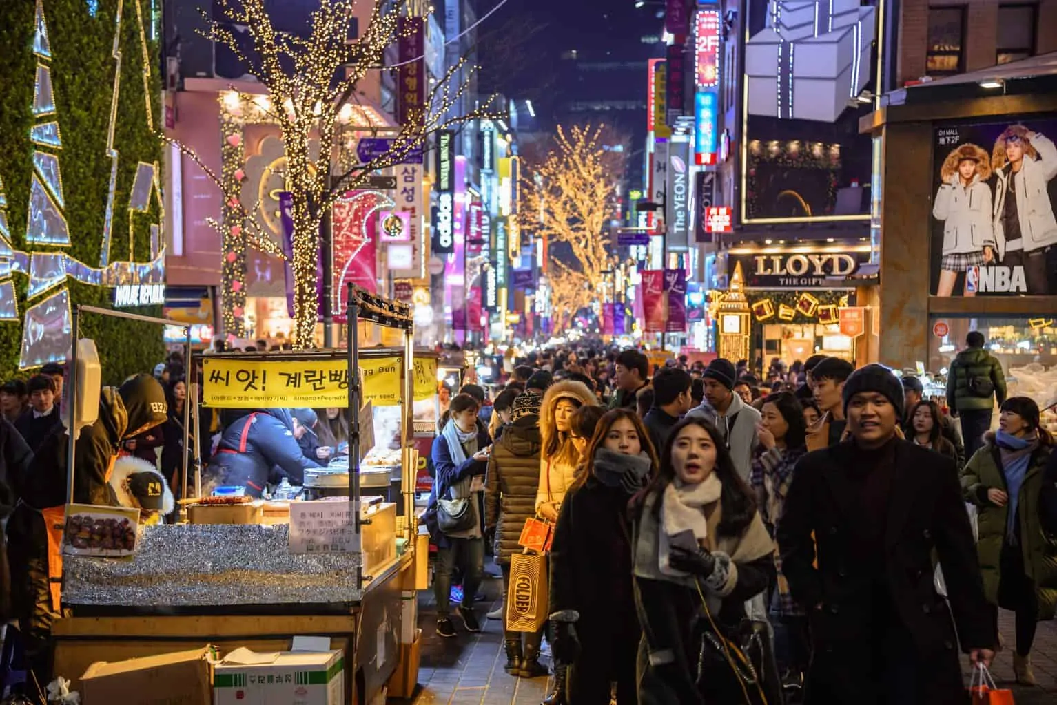 Crowd of people that drives one of the main streets of Seoul during the holiday season