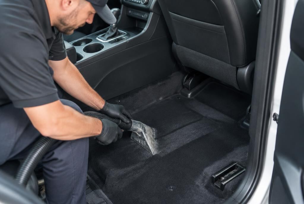 Technician detailing a car in Mira Mesa