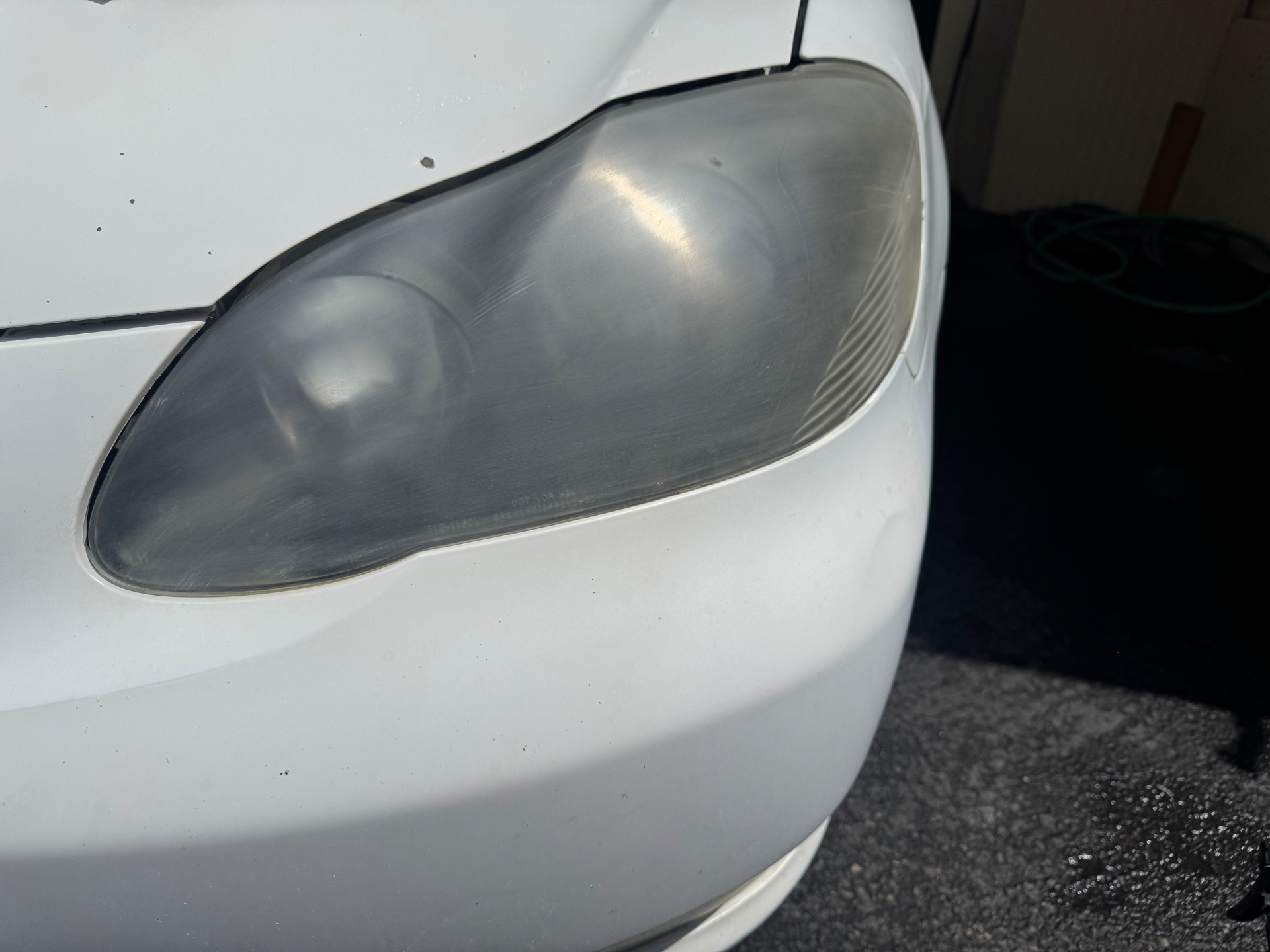 Headlight Restoration  — before detailing, showing dirt and wear
