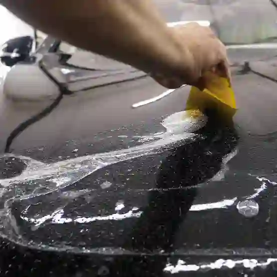 Paint protection film being installed on a vehicle