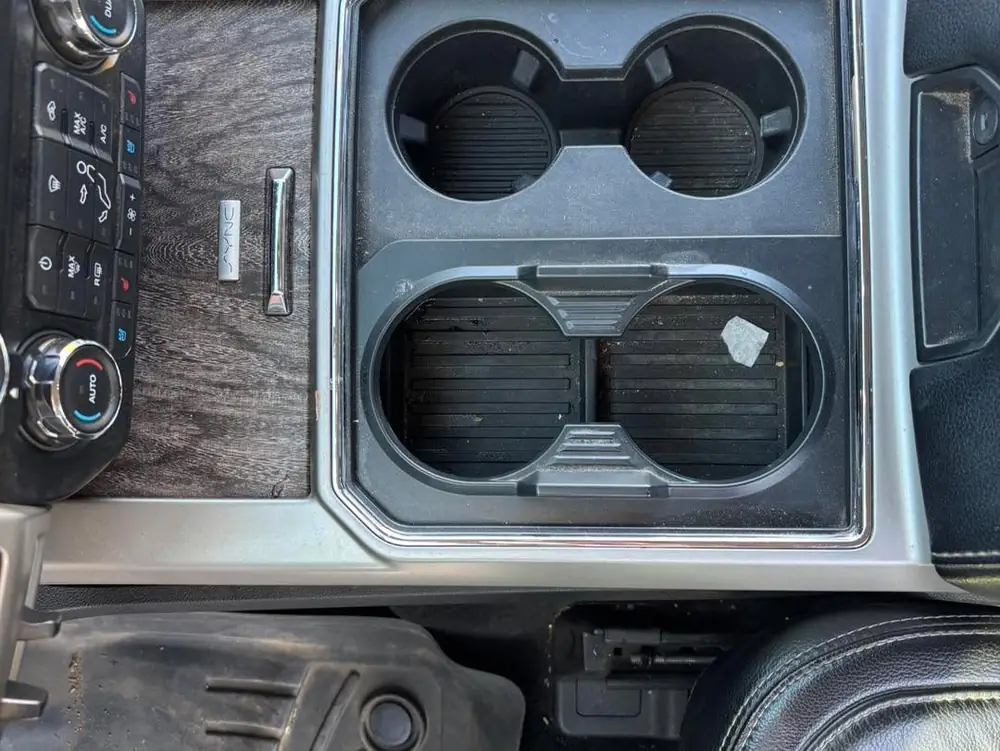 Center Console Detail — before detailing, showing dirt and wear